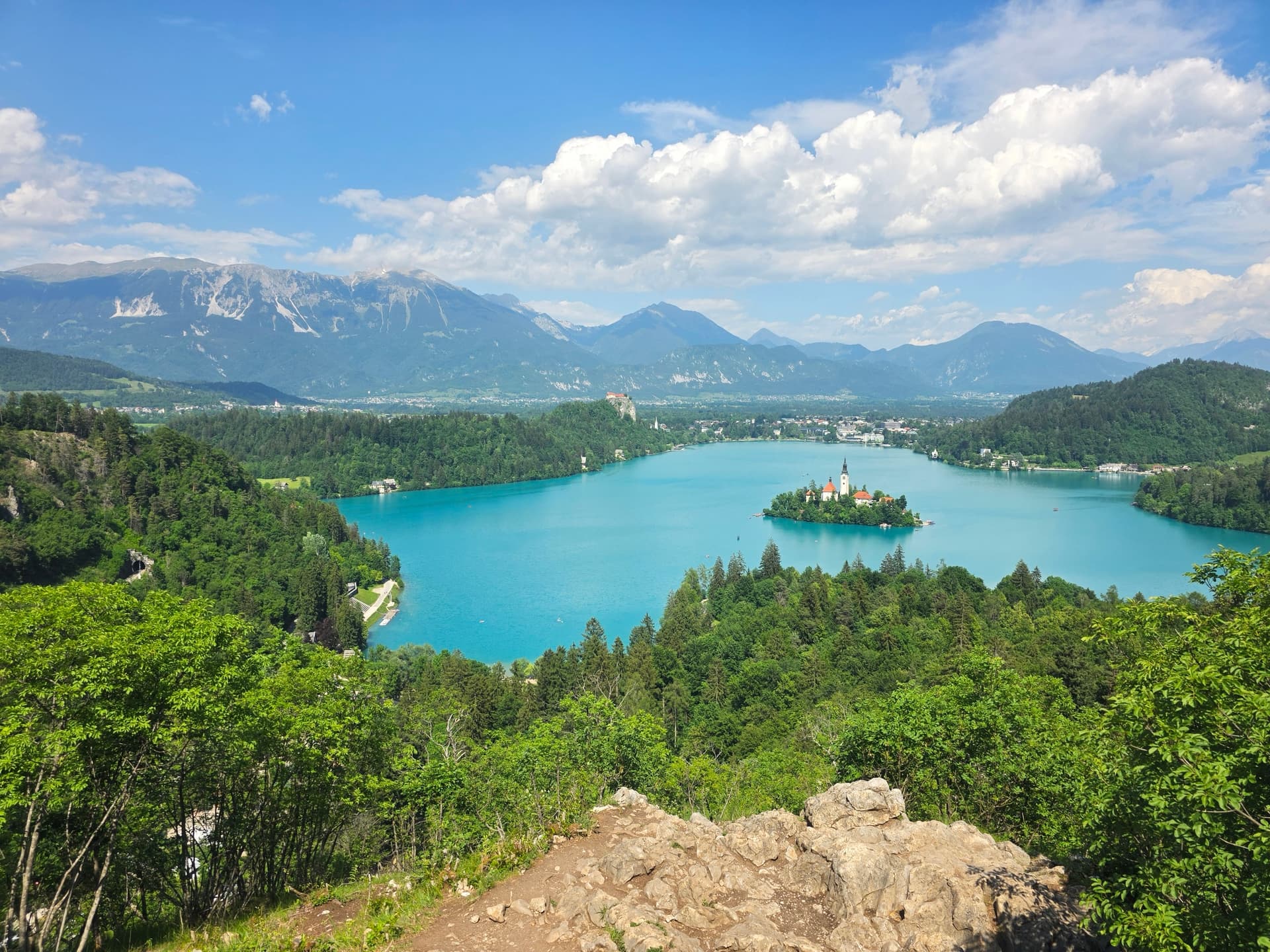 Lake Bled island church with turquoise water and surrounding mountains in Slovenia
